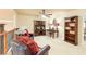 Lofted living area featuring comfortable seating, a ceiling fan, and natural light at 5095 Hamby Hollow Ln, Cumming, GA 30028