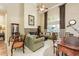 Spacious living room featuring high ceilings, a fireplace, and large windows at 5095 Hamby Hollow Ln, Cumming, GA 30028