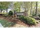 Community signage for Sentinel Grove nestled in a lush, wooded neighborhood at 5095 Hamby Hollow Ln, Cumming, GA 30028