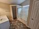 Bathroom featuring a shower and tub combination with glass door and vanity sink at 6718 Roscommon Dr, Austell, GA 30168