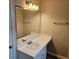 Bathroom with large mirror, vanity sink and updated lighting fixture at 6718 Roscommon Dr, Austell, GA 30168