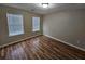 Bedroom with hard wood flooring and natural light at 6718 Roscommon Dr, Austell, GA 30168
