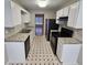 Functional kitchen featuring white cabinets, modern appliances, and ample counter space at 6718 Roscommon Dr, Austell, GA 30168