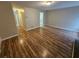 Open-concept living room showcasing modern flooring and seamless flow to other areas of the home at 6718 Roscommon Dr, Austell, GA 30168