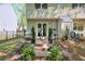 Charming backyard with lush greenery, tiered patio, and inviting seating area at 1153 Haven Brook Ln, Brookhaven, GA 30319
