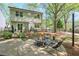 Inviting backyard featuring a patio with firepit and well-manicured lawn perfect for outdoor entertaining at 1153 Haven Brook Ln, Brookhaven, GA 30319