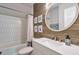 Bright bathroom featuring a modern vanity with marble countertops and a bathtub with unique wall tiles at 1153 Haven Brook Ln, Brookhaven, GA 30319