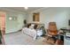 The bedroom leads into the bathroom with wood floors and light gray walls at 1153 Haven Brook Ln, Brookhaven, GA 30319