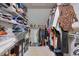 Spacious walk-in closet with shelves and hanging space, offering ample storage for clothes and accessories at 1153 Haven Brook Ln, Brookhaven, GA 30319