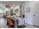 Dining room with hardwood floors and decorative elements leads to the kitchen with stainless steel appliances at 1153 Haven Brook Ln, Brookhaven, GA 30319