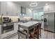 Modern kitchen featuring stainless steel appliances, white cabinets, and a functional island at 1153 Haven Brook Ln, Brookhaven, GA 30319