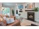 Stylish living room with a modern fireplace, soft lighting, and a comfortable seating arrangement at 1153 Haven Brook Ln, Brookhaven, GA 30319