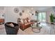 Cozy living room with comfortable seating, decorative wall art, and a view of the outdoor space at 1153 Haven Brook Ln, Brookhaven, GA 30319
