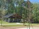 An outdoor covered pavilion with stone pillars and a picnic table at 1153 Haven Brook Ln, Brookhaven, GA 30319