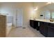 Bathroom with tiled floors, a bathtub and shower combination, and dark vanity with white countertop at 257 Ironwood Dr, Stockbridge, GA 30281