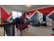 Bonus room showcasing unique geometric artwork, a comfy chair, and beanbag seating at 257 Ironwood Dr, Stockbridge, GA 30281
