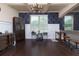 Elegant dining space featuring hardwood floors, unique decor, and a classic chandelier at 257 Ironwood Dr, Stockbridge, GA 30281