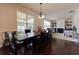 Open dining and living room area, features dark floors, lots of natural light, and a gas fireplace at 257 Ironwood Dr, Stockbridge, GA 30281