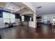Spacious living and dining area boasts dark hardwood floors, a stylish bar, and ample seating at 257 Ironwood Dr, Stockbridge, GA 30281