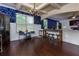 Open-concept living area with dark hardwood floors and decorative accent walls at 257 Ironwood Dr, Stockbridge, GA 30281