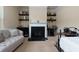 Open living room space features a gas fireplace, dry bar, and comfortable couch at 257 Ironwood Dr, Stockbridge, GA 30281