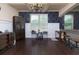Spacious living room with dark hardwood floors and views into other living spaces at 257 Ironwood Dr, Stockbridge, GA 30281