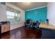 Bright office with stylish wallpaper, hardwood floors, and views of the outdoors at 257 Ironwood Dr, Stockbridge, GA 30281