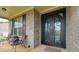 Inviting front porch features an ornate front door and room to relax at 257 Ironwood Dr, Stockbridge, GA 30281