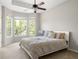 Bedroom with large windows, neutral carpet, and a ceiling fan at 375 Highland Ne Ave # 508, Atlanta, GA 30312