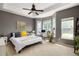 Spacious bedroom featuring a ceiling fan, bay windows, a bed, and a cozy workspace at 375 Highland Ne Ave # 508, Atlanta, GA 30312