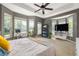 Bedroom with ceiling fan, bay windows, desk, bookshelf and TV on console at 375 Highland Ne Ave # 508, Atlanta, GA 30312