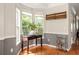 Bright dining area with hardwood floors, corner windows, and elegant decor at 375 Highland Ne Ave # 508, Atlanta, GA 30312