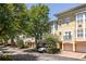 Townhome exterior with garages, landscaping, and brick accents at 375 Highland Ne Ave # 508, Atlanta, GA 30312
