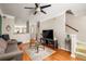 Comfortable living room with hardwood floors, staircase access, and neutral decor at 375 Highland Ne Ave # 508, Atlanta, GA 30312