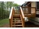 Exterior wooden deck and stairs that extend to the yard of the house at 4907 Windsor Downs Dr, Decatur, GA 30035