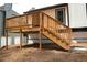 The exterior is a wooden deck with stairs extending to the yard of the house at 4907 Windsor Downs Dr, Decatur, GA 30035