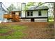Spacious backyard featuring a wooden deck and lush green surroundings at 4907 Windsor Downs Dr, Decatur, GA 30035
