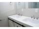 Modern bathroom featuring double sinks, sleek hardware, and minimalist design at 4907 Windsor Downs Dr, Decatur, GA 30035