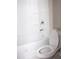 Bathroom showcasing a clean white bathtub and shower combo with matching toilet at 4907 Windsor Downs Dr, Decatur, GA 30035