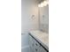 Bright bathroom featuring a white vanity with modern hardware and a sleek countertop at 4907 Windsor Downs Dr, Decatur, GA 30035