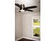 Bedroom featuring a ceiling fan and window overlooking a green yard at 4907 Windsor Downs Dr, Decatur, GA 30035