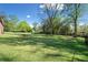 A view of the grassy backyard, offering plenty of space for outdoor activities and recreation at 630 Cambridge Dr, Marietta, GA 30066