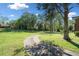 Expansive backyard view featuring mature trees and lush green lawn at 630 Cambridge Dr, Marietta, GA 30066