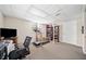Finished basement area with a treadmill and a large screen television at 630 Cambridge Dr, Marietta, GA 30066