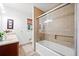 Bathroom featuring a tiled shower with glass door and a modern vanity at 630 Cambridge Dr, Marietta, GA 30066