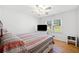 Bedroom with a ceiling fan, hardwood floors, and view of the front yard at 630 Cambridge Dr, Marietta, GA 30066