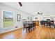 Hardwood floors in the dining room, featuring a stylish table and chairs and plenty of natural light from large windows at 630 Cambridge Dr, Marietta, GA 30066