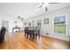 Bright living room with hardwood floors, classic furnishings, and natural light streaming through large windows with mini blinds at 630 Cambridge Dr, Marietta, GA 30066