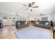 Spacious living area with hardwood floors, recessed lighting, ceiling fans, modern furnishings, and an open floor plan at 630 Cambridge Dr, Marietta, GA 30066