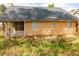 View of the home's backyard, featuring a covered porch and spacious yard area at 1960 Banks Way, Atlanta, GA 30349